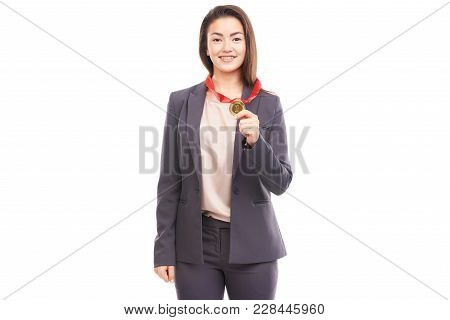 Young Businesswoman Wearing Golden Medal On Red Ribbon