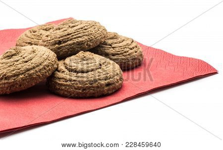 Cocoa Oat Cookies On A Red Napkin Isolated On White Background Five Drop Shape Brown And Crispy Bisc