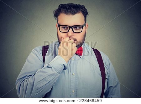Portrait Of A Preoccupied Anxious Young Man Looking Down