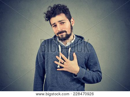 Young Man Asking To Apologize Him Looking With Regret At Camera.