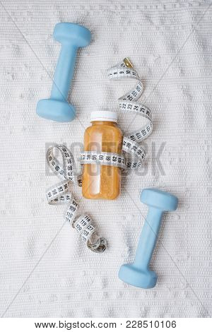 Detox Drink With Dumbbells And Measuring Tape. Free Space For Text. Concept: Detox And Fitness, Diet