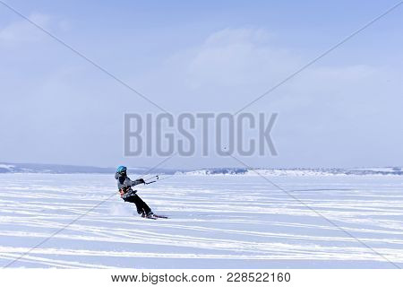 Perm, Russia - February 23, 2018: Snow Kiter Glides On The Ice Of The Kama Reservoir