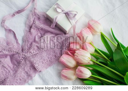 Beautiful Lace Lingerie. Cosmetics, Decorations, A Bouquet Of Tulips. Gift. A Box With A Gift. Inter