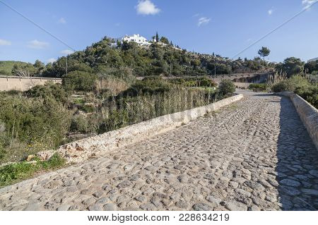 Santa Eularia Des Riu, Spain- January 12, 2018: Ancient Bridge Landscape Puig De Missa Hill.santa Eu
