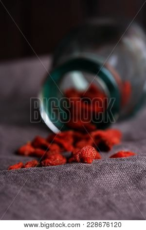 Goji Berries On A Dark Linen Background Selective Soft Focus