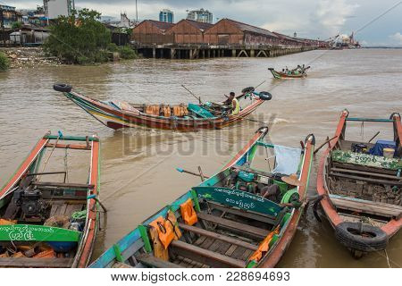 Yangon, Myanmar - September 26, 2016: Traditional river taxi ferry boats in Yangon, Burma