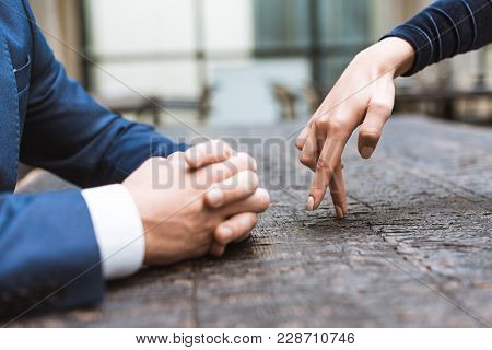 Cropped Shot Of Woman Making Steps With Figers To Her Boyfriend