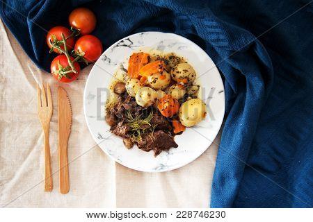 Beef meat stewed with potatoes-Traditional French cuisine Beef Bourguignon potatoes carrots in persillade