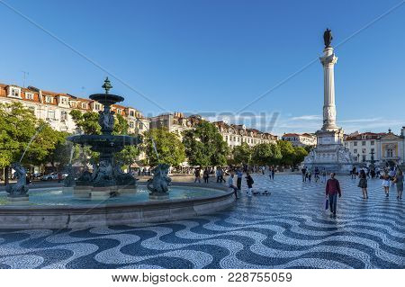 Lisbon, Portugal - October 22, 2017: View Of The Rossio Square With Tourists Walking By, In The Pomb