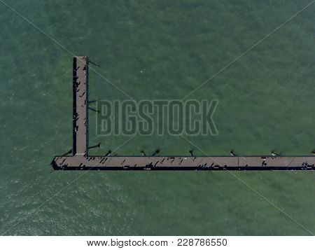An Aerial, Top-down View Of The Pacifica Municipal Pier In Pacifica, California.