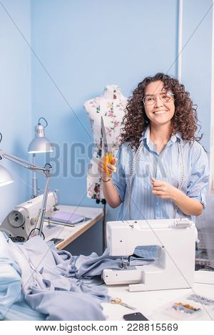 Score Twice Befor You Cut Once.happy Dressmaker With Scissors. Process Of Cutting