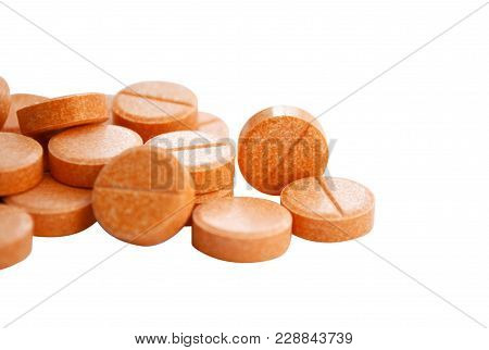 Many Isolated Orange Round Pills Macro Closeup