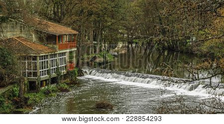 The River As It Passes Through The Medieval Village Of Allariz In Galicia, Spain