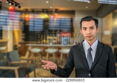 Asian Man With Customer Service Blurred Background.using Life Insurance Or Health, Business Or Welco