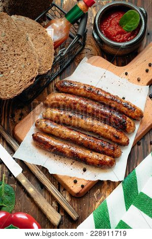 Pork Chipolata. Close-up View Of Fried Sausages. Meat Dish.