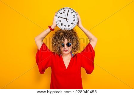 Portrait Of A White Woman With Afrro Curly Hairstyle In Red Dress And Sunglasses Holding Watches Abo