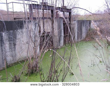 An Old Ruined Abandoned Dam To Discharge Water Into A Swampy Body Of Water A Hydroengineering Struct
