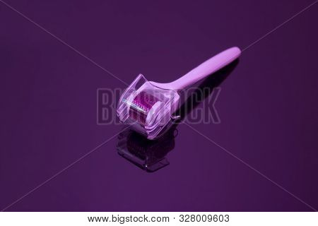 Mezoroller, Dermaroller, Mesotherapy Skin Tool. A Mesoroller With A White Handle And A Pink Rabbit O