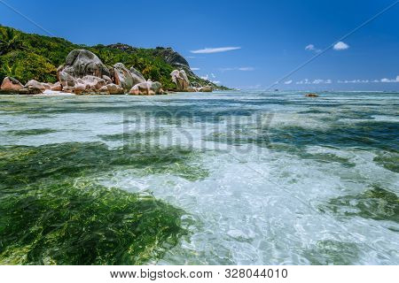 Anse Source Dargent - Paradise Tropical Beach. Shallow Lagoon On Low Tide, Granite Boulders And Palm