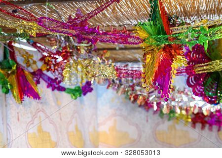 Traditional Sukkah For The Jewish Holiday Sukkot. Colorful Suka Decoration Shiny Garland At Sunset L