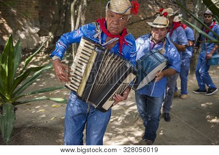 Caruaru, Pernambuco, Brazil - July 11, 2016: Men Wearing Traditional Clothes And Straw Hat Plays Acc