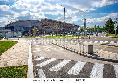 Bratislava, Slovakia - October 6 2019: View Of Bratislava Airport Terminal With Parking Lot Full Of 