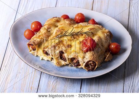 Six Italian Canneloni Pasta Rolls On Wood