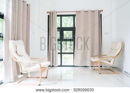 Wooden Armchair Sofa In Modern Room With Curtain On Glass Wondow