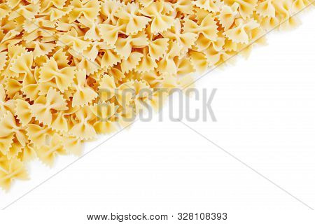 A Variety Of Types And Shapes Of Italian Pasta. Dry Pasta Bows Farfalle.  Heap Of Bow Tie Macaroni I