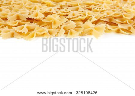 A Variety Of Types And Shapes Of Italian Pasta. Dry Pasta Bows Farfalle.  Heap Of Bow Tie Macaroni I