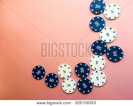 Chips For Poker On Pink Background. Five And Fifty Chips.oker Play. Place For Text.
