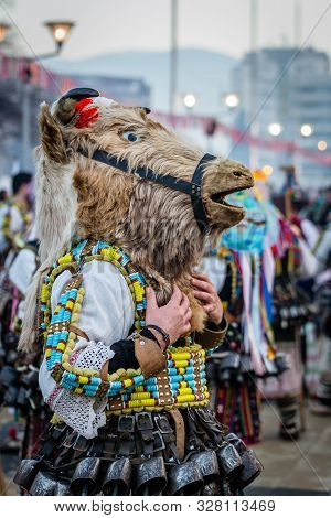 Mummers perform rituals to scare evil spirits at Surva festival at Pernik in Bulgaria. The people with the masks are called Kuker (kukeri). Horse mask.