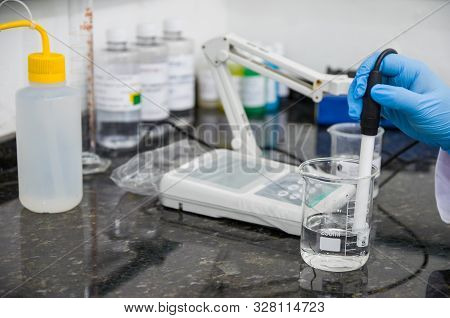 Woman Hands Performing Ph Test On Ph Meter Electronic Instrument