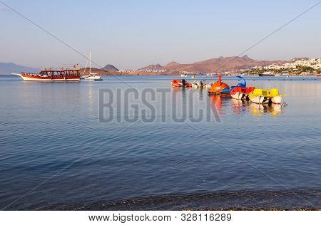 Beautiful Sunrise On Mediterranean Coast With Islands And Mountains, Boats And Catamarans