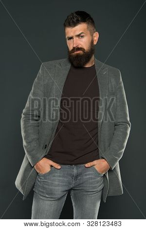 Bearded And Barbate. Bearded Man Keeping Arms In Pockets On Grey Background. Bearded Hipster In Casu