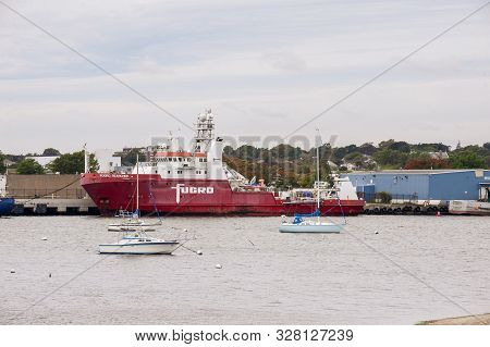 New Bedford, Massachusetts, Usa - October 8, 2019: Sailboats At Anchor Near Survey Vessel Fugro Sear