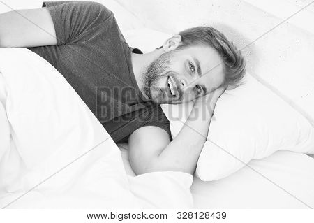 Experiencing A Supreme Pleasure. Single Man Smiling After Waking Up In Morning. Single Person Lying 