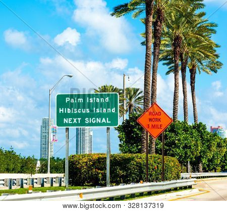 Palm Island And Hibiscus Island Road Sign In Miami, Usa