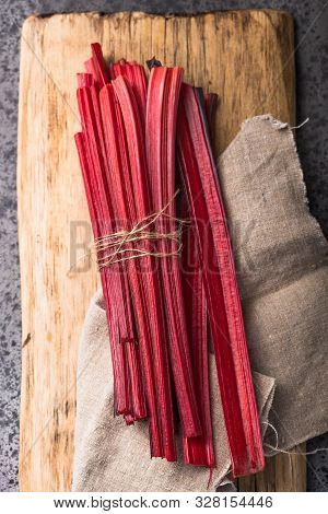 Chard Or Rhubarb. Fresh Raw Leaves Of Swiss Chard,  Beets, Mangold, On A Concrete  Table, Copy Space