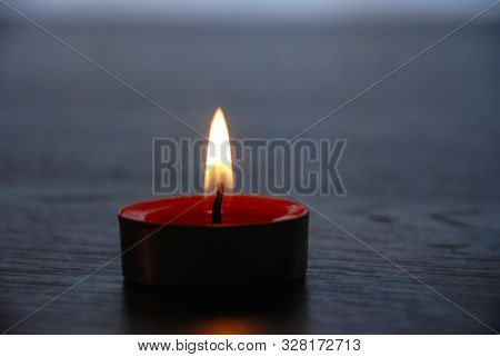 Red Candle Burning. Red Candle Burning On Black Background For Background Pictures
