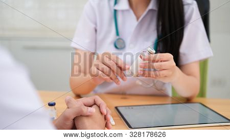 Doctor Giving Medical Advice To Patient.