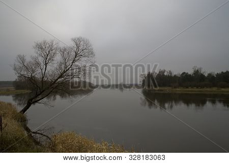Beautiful Polish Autumn Cold Gray Cloudy November Landscape Of Podlasie With The River Bug