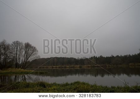 Beautiful Polish Autumn Cold Gray Cloudy November Landscape Of Podlasie With The River Bug