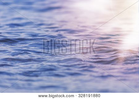 Sea Wave Close Up With Low Angle View Sunrsie Shot. Background Texture For Text Or Design.