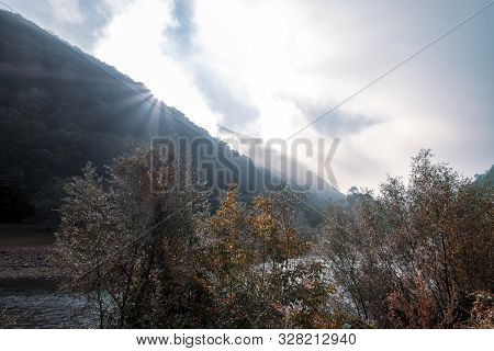 Autumn Scene At The Olt River On A Cloudy Day In Romania.