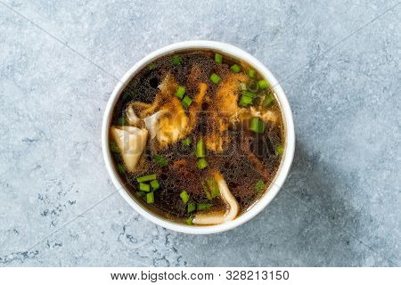 Take Away Asian Food Wonton Soup With Bok Choy And Chives In Plastic Bowl Package Or Container Box.