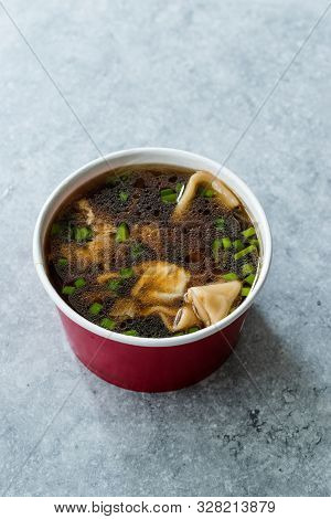 Take Away Asian Food Wonton Soup With Bok Choy And Chives In Plastic Bowl Package Or Container Box.