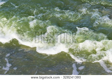 Green Water In The Sea Lagoon. The Lagoon Is A Bay Separated From The Sea. The Color Of Water Is Due