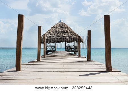 Lake Dock With Hammocks At A Sunny Day, El Remate, Guatemala