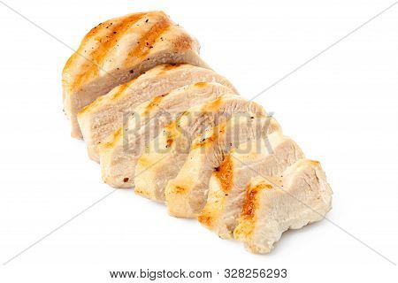 Partially Sliced Grilled Chicken Breast With Grill Marks, Ground Black Pepper And Salt Isolated On W